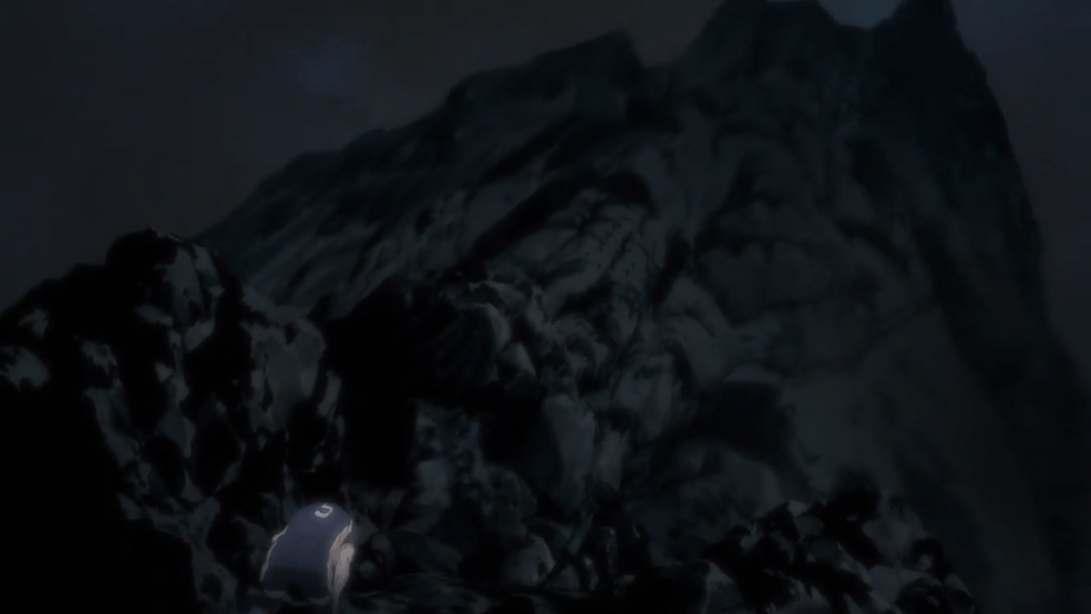Tanaka struggling at the bottom of a cliff which resembles his aspirations.